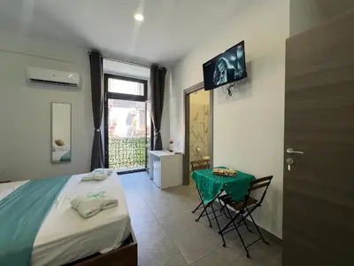 Letto o letti in una camera di TREASURE ROOMs