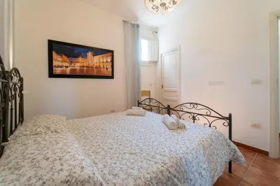 Letto o letti in una camera di GuestHost - La Casa dei Mori - Ortigia Central Apartment