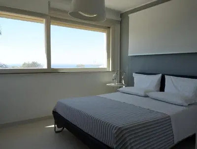 Letto o letti in una camera di Terrazza sul Plemmirio