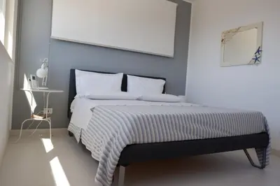 Letto o letti in una camera di Terrazza sul Plemmirio