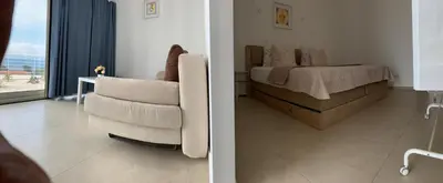 Letto o letti in una camera di Bellavista