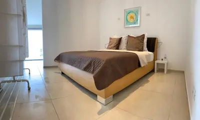 Letto o letti in una camera di Bellavista