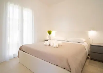 Letto o letti in una camera di Baia Marzamemi Appartamenti Eleganti con Piscina e Terrazza Privata