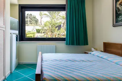 Letto o letti in una camera di Villa del Golfetto