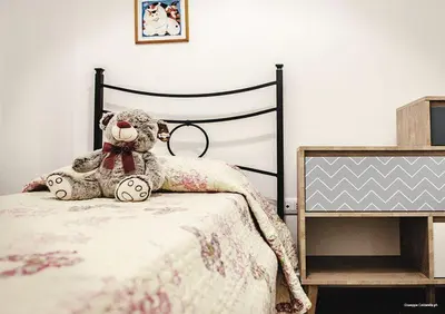 Letto o letti in una camera di Casa Nonna Fortunata
