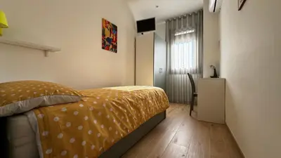 Letto o letti in una camera di Casa vacanze Le Agavi