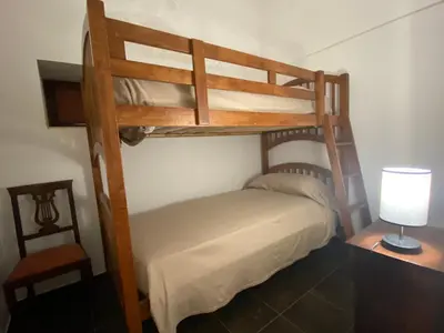 Letto o letti in una camera di Agriturismo Il Melograno