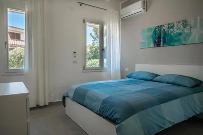 Letto o letti in una camera di Direzione Sud - Fontane Bianche