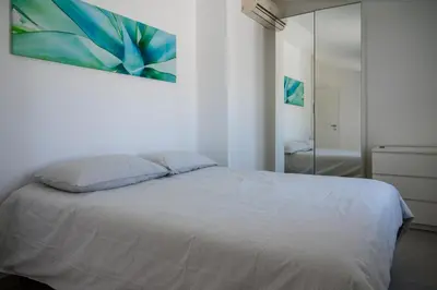 Letto o letti in una camera di Direzione Sud - Fontane Bianche