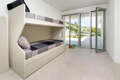 Letto o letti in una camera di Villa Anna