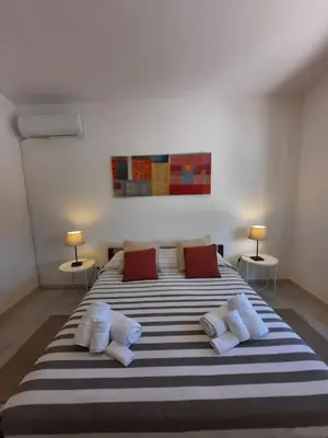 Letto o letti in una camera di Villa Nina