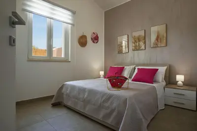 Letto o letti in una camera di Villa Shamsi - heated pool and beach at 70mt
