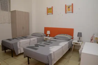 Letto o letti in una camera di Casa Bommegna