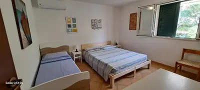 Letto o letti in una camera di CasaSicula - Artemis House