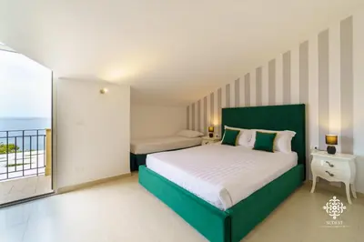 Letto o letti in una camera di Villa Vittoria - Waterfront house