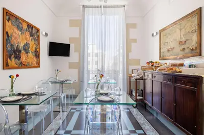 TV o dispositivi per l'intrattenimento presso Archimede Charm B&B - Historical Palace in Ortigia
