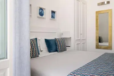 Letto o letti in una camera di Archimede Charm B&B - Historical Palace in Ortigia