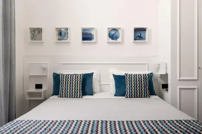 Letto o letti in una camera di Archimede Charm B&B - Historical Palace in Ortigia