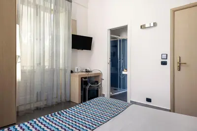 Letto o letti in una camera di Archimede Charm B&B - Historical Palace in Ortigia
