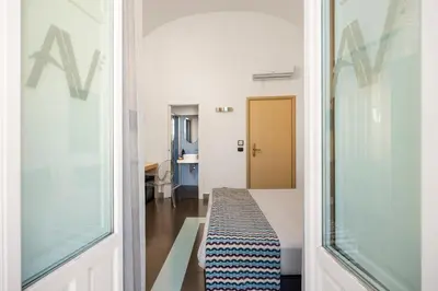 Letto o letti in una camera di Archimede Charm B&B - Historical Palace in Ortigia
