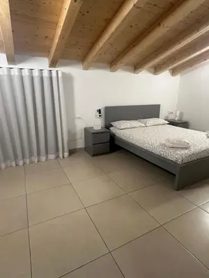 Letto o letti in una camera di La Claudette Apartment Catania