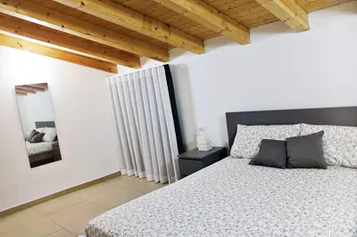 Letto o letti in una camera di La Claudette Apartment Catania