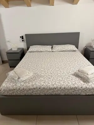 Letto o letti in una camera di La Claudette Apartment Catania