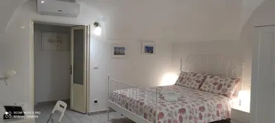 Letto o letti in una camera di Dietro il Teatro casa confortevole in pieno centro