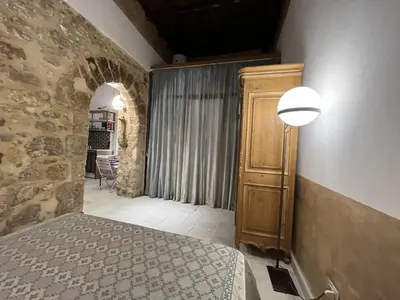 Letto o letti in una camera di VERMEXIO SUITE