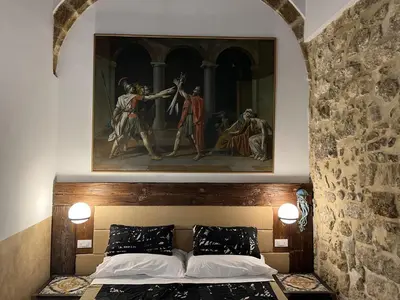 Letto o letti in una camera di VERMEXIO SUITE