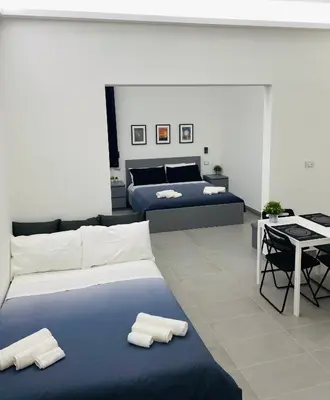 Letto o letti in una camera di Sicilian Rooms