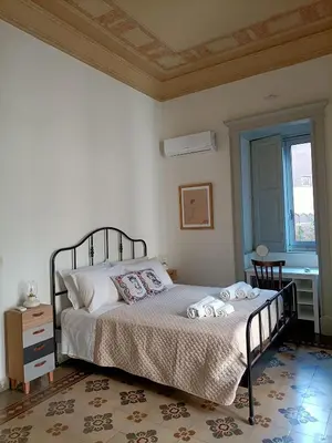 Letto o letti in una camera di Stesicoro Art Home, in centro storico a Catania