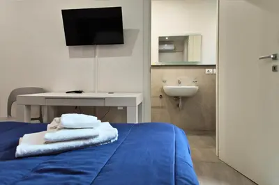 Letto o letti in una camera di Home De Curtis