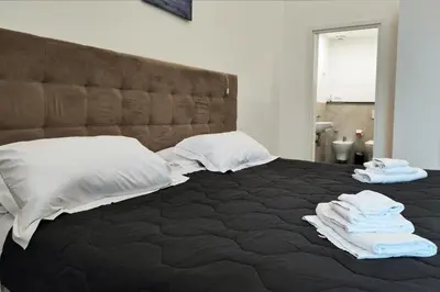Letto o letti in una camera di Home De Curtis