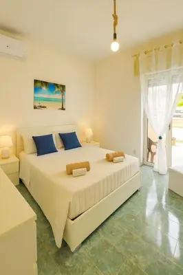 Letto o letti in una camera di Villa Sud Sicily