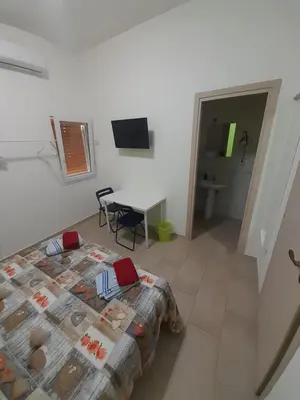 Letto o letti in una camera di CTA Catania Aeroporto fontanarossa