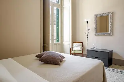 Letto o letti in una camera di Cavour Apartments by Wonderful Italy