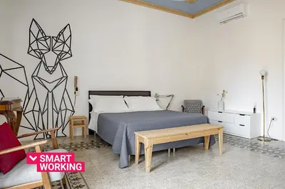 Letto o letti in una camera di Cavour Apartments by Wonderful Italy