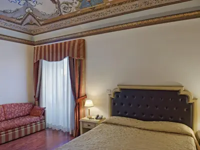 Letto o letti in una camera di Hotel Manganelli Palace