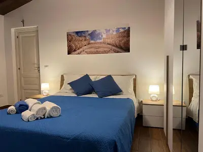 Letto o letti in una camera di Chiarilu'
