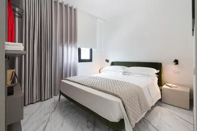 Letto o letti in una camera di Villa Hermes