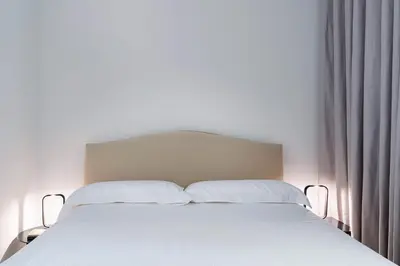 Letto o letti in una camera di Villa Hermes