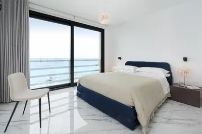 Letto o letti in una camera di Villa Hermes