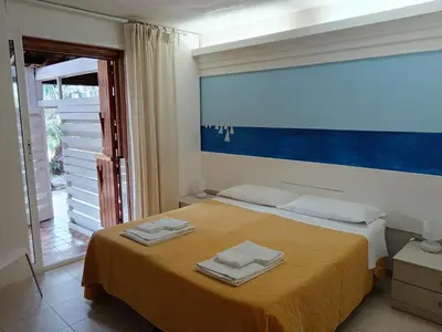 Letto o letti in una camera di Villa Aurea