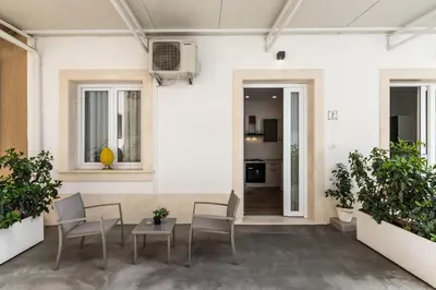 Area soggiorno di Cortile Siciliano Apartments