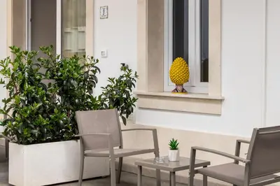 Area soggiorno di Cortile Siciliano Apartments