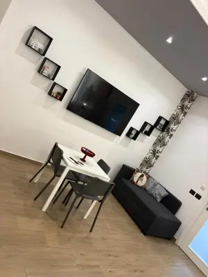 TV o dispositivi per l'intrattenimento presso Catania Station Luxury Suite