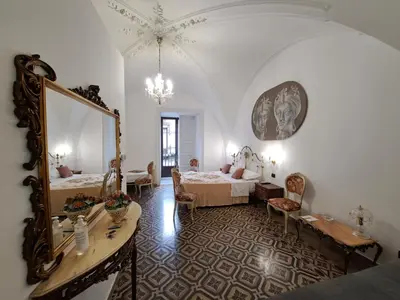 Letto o letti in una camera di Terra d'Amuri Hotel Boutique