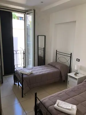 Letto o letti in una camera di Terrazza famà