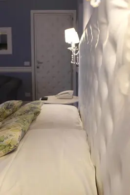 Letto o letti in una camera di Hotel Il Barocco